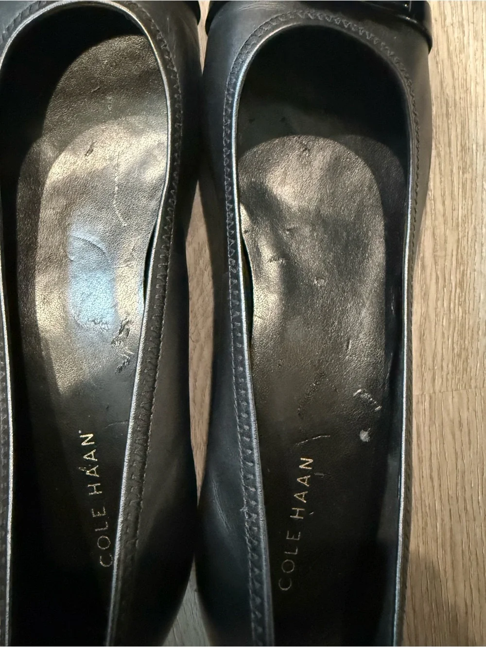 Cole Haan Black Leather Round-Toe Ballet Wedge Heels with Gold Logo Accent